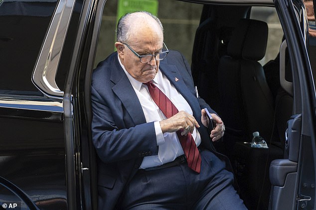 Rudy Giuliani steps out of his car in front of the federal courthouse in Washington on Monday morning.  He highlighted that Ruby Freeman and Shaye Moss pulled out suitcases of illegal ballots to help President Joe Biden win in the swing state of Georgia