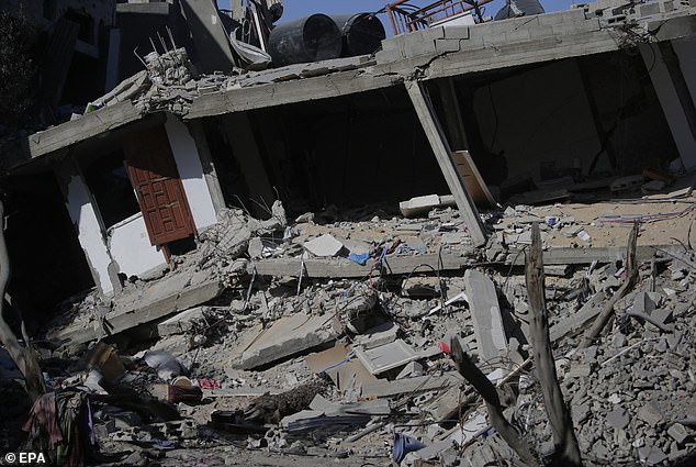 According to the Palestinian Civil Defense, a single attack killed more than 60 members of two families.  This photo shows the rubble of a destroyed house used by the Al Madfaa and Shabit families in the Al Maghazi refugee camp, southern Gaza Strip