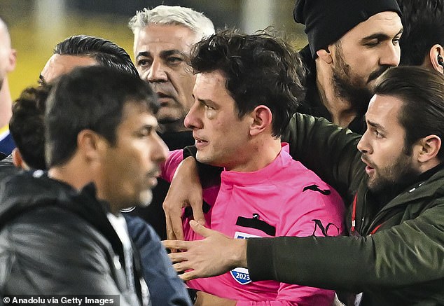 A group of players, officials and security guards formed a protective huddle around Meler, who was seen with a swollen eye in the moments after the attack.