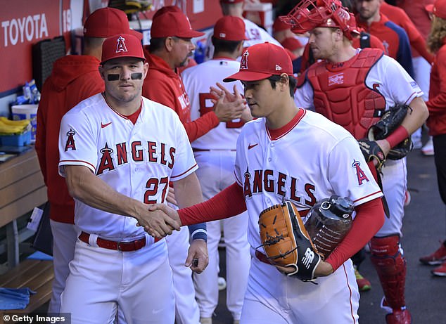 Before Ohtani's deal, his ex-teammate with the Angels - Mike Trout (L) - was the highest-paid star