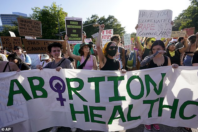 Protesters march and gather near the Texas State Capitol in Austin following the Supreme Court's decision to overturn Roe v. Wade on June 24, 2022.