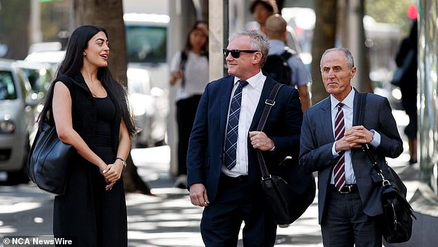 Kent (pictured, centre, outside court on Tuesday) was fired from his position at Fox Sport and the Daily Telegraph shortly after being charged