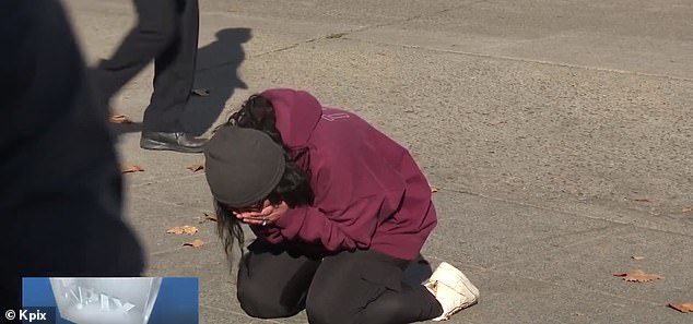 Snow breaks down in tears outside the store after hearing that her father has died