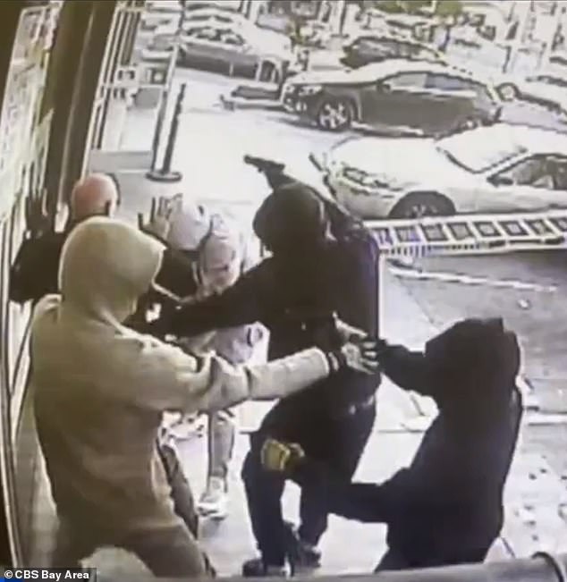 A gang of armed men attacked an armed guard before robbing a truck full of cigarettes in broad daylight in Oakland on November 25