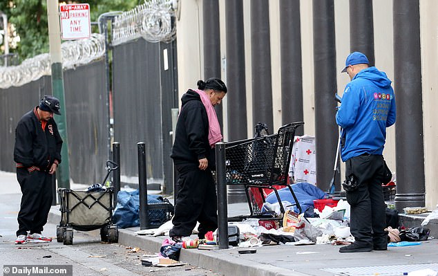 Shopping carts and trash litter the sidewalk in San Francisco's Tenderloin District