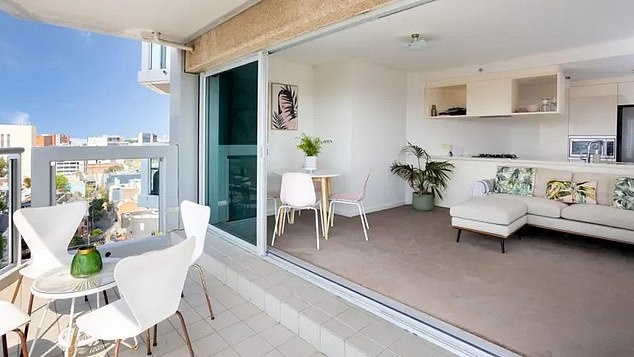 Designed to make the most of its picturesque location, the apartment offers an open-plan layout, with a kitchen adjacent to the lounge area and floor-to-ceiling windows.