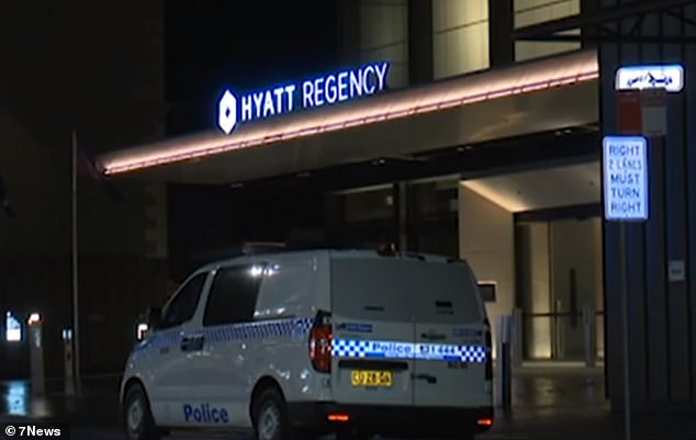 Police have charged the now 51-year-old man with 'taking/detaining a person with intent to gain advantage' in connection with an alleged crime of domestic violence (pictured, police outside the Hyatt Regency after Ms Lovell's death)