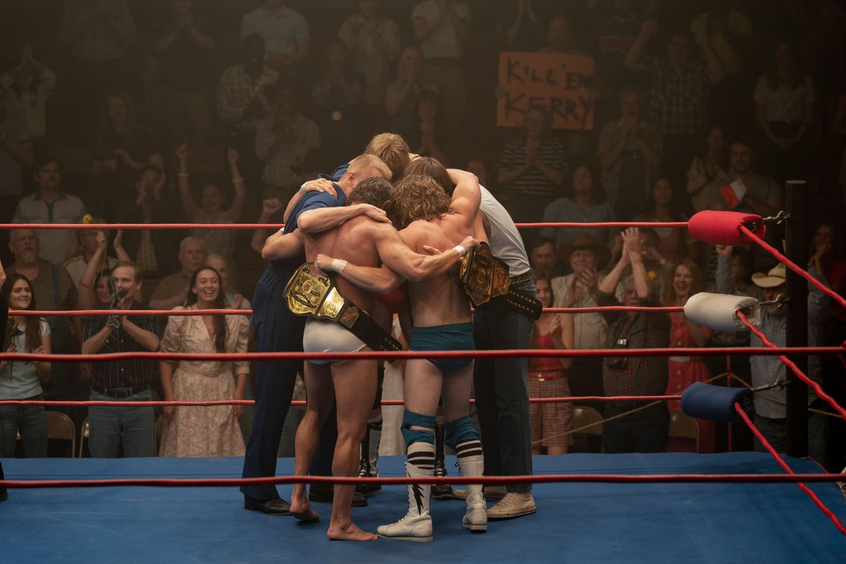 The Von Erich family embraces in the middle of the ring in The Iron Claw