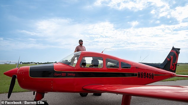 Mr Ellis poses with the red 1968 single-engine plane he bought just before getting his pilot's license and which crashed on Sunday