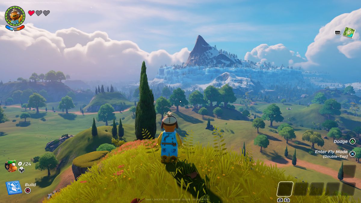 A Lego Fortnite character stands on a hill looking down at a valley in one of the best seeds in Lego Fortnite.