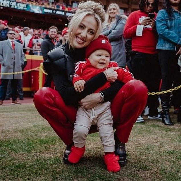 Other photos in the carousel showed Brittany cradling her son on the sidelines