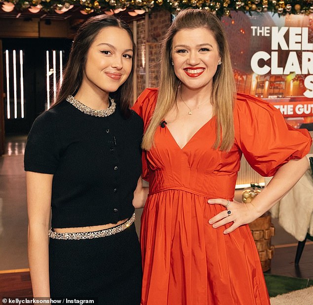 On Tuesday, the singer had Olivia Rodrigo on the show to talk about her new album GUTS.  Rodrigo and Kelly swapped stories about their most gutsy moments, including Kelly getting a tattoo on her middle finger to remember a time she stood up for herself, and Olivia performing on Saturday Night Live for the second time ever in her career