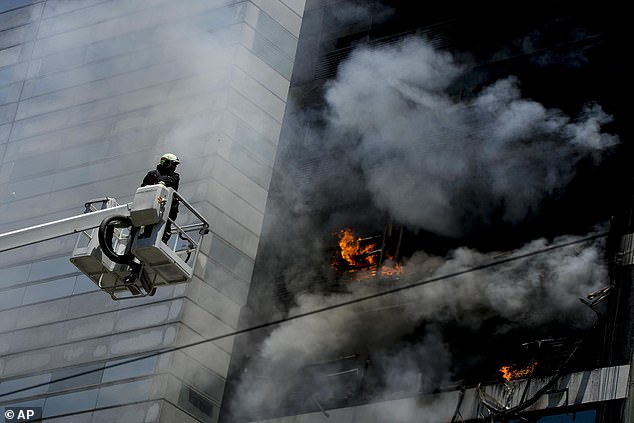 Local media reported that at least 12 people were detained on the building's terrace and at the rear of the building