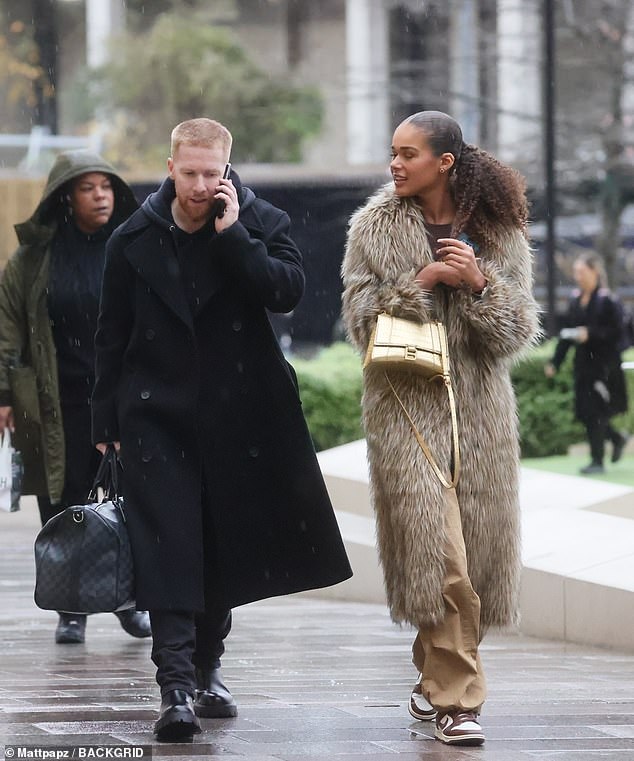 Tillie looked typically stylish in a faux fur coat and beige trousers, teamed with Nike sneakers