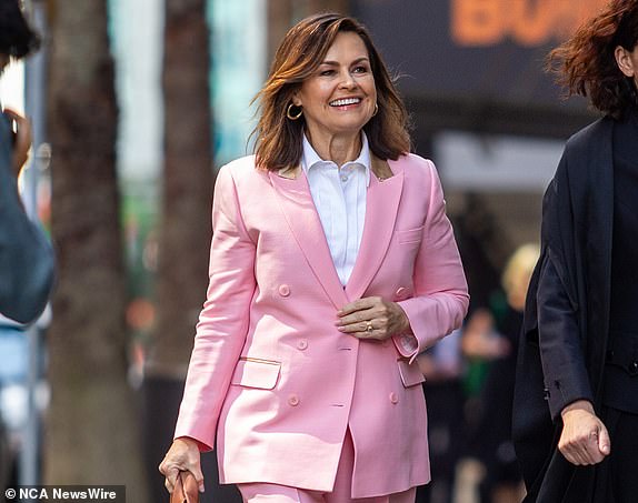 SYDNEY, AUSTRALIA - NewsWire Photos December 12, 2023: Lisa Wilkinson (L) arrives at the Federal Court in Sydney.  Photo: NCA NewsWire / Christian Gilles