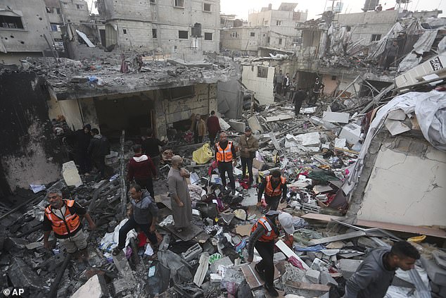 Palestinians search for survivors after an Israeli bombardment of the city of Rafah in southern Gaza