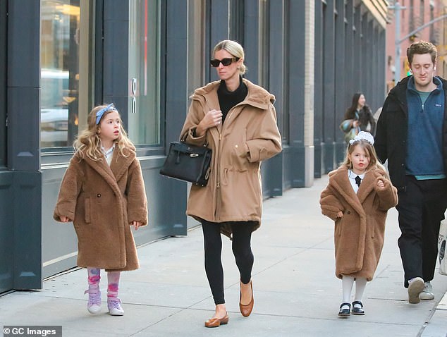 The businesswoman was seen walking alongside her daughters, who were dressed warmly in matching teddy bear coats