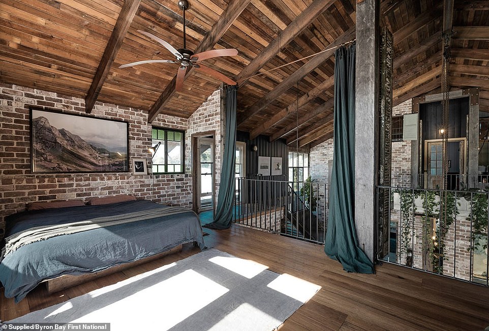 Surrounding the attic is the master bedroom with a private balcony, home office and en suite bathroom.  High curtains and antique shutters give the master bedroom privacy from the attic, while wooden vaulted ceilings add to the grandeur of the space