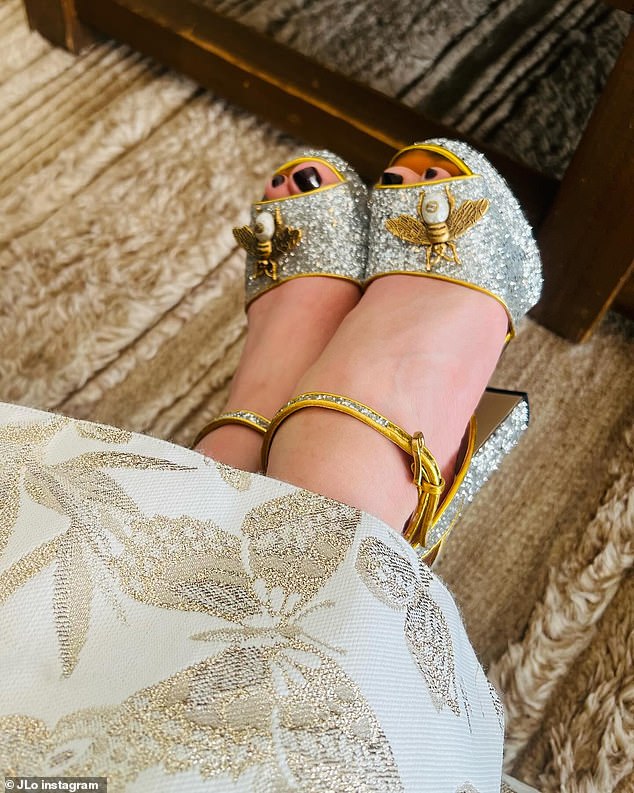 She shared a photo on social media of her beautiful shoes with silver sequins, gold trim and gold and pearl bee embellishments