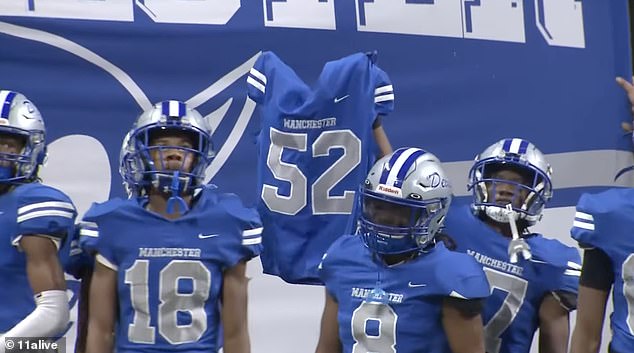 And his teammates honored him by holding up his jersey before the championship game