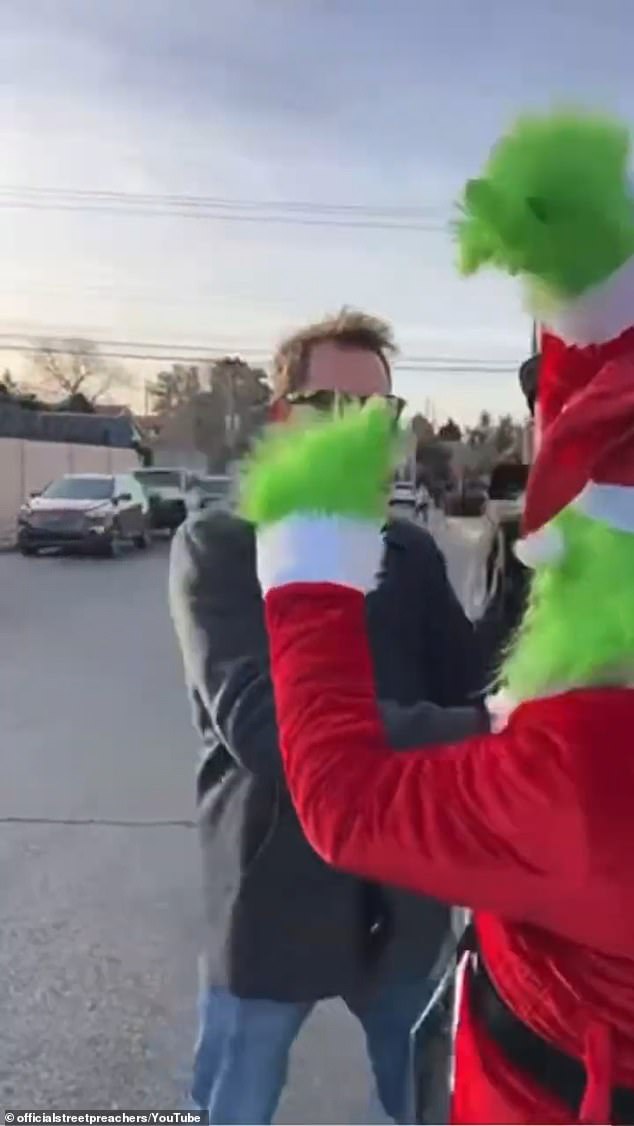 Grisham, 63, who is part of a group called street preachers, is said to have spent up to 45 minutes outside the school, walking up and down the sidewalk in an attempt to spread the message.