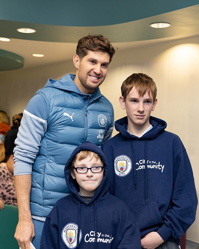 Stones posed for photos with patients at the Royal Manchester Children's Hospital in Manchester and also delivered gifts