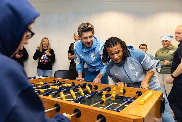 Players donated gift bags and blankets to the children of the Treble winners during their visit - and enjoyed table football