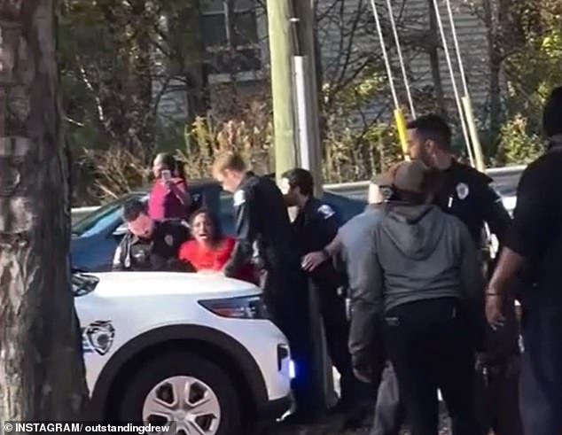 Pierre is seen screaming as the group of officers transport her to the vehicle.  In the video, Pierre said: 'What's going on?  What have I done?  What have I done?'