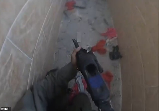 The IDF soldier returns to the corridor to recover before a grenade is thrown by the second Hamas gunman