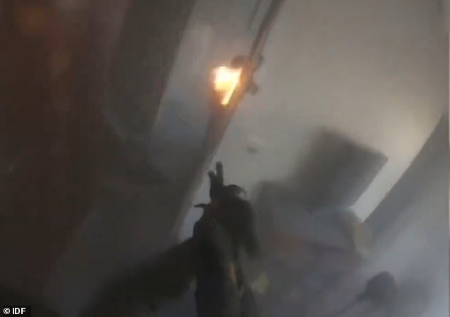 The IDF soldier burst back into the room, turned the corner and looked at the second terrorist