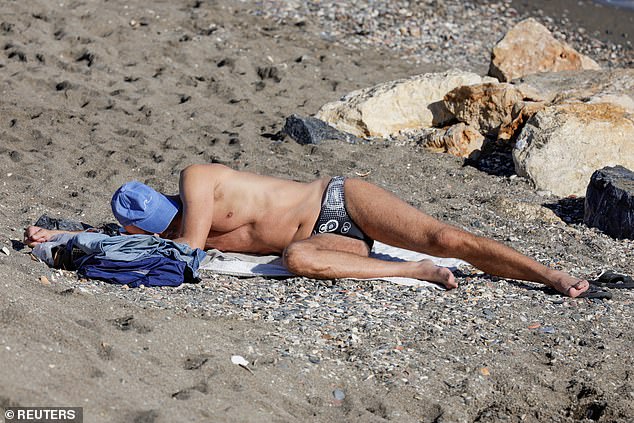 Some were seen taking naps on Malagueta beach in the scorching heat