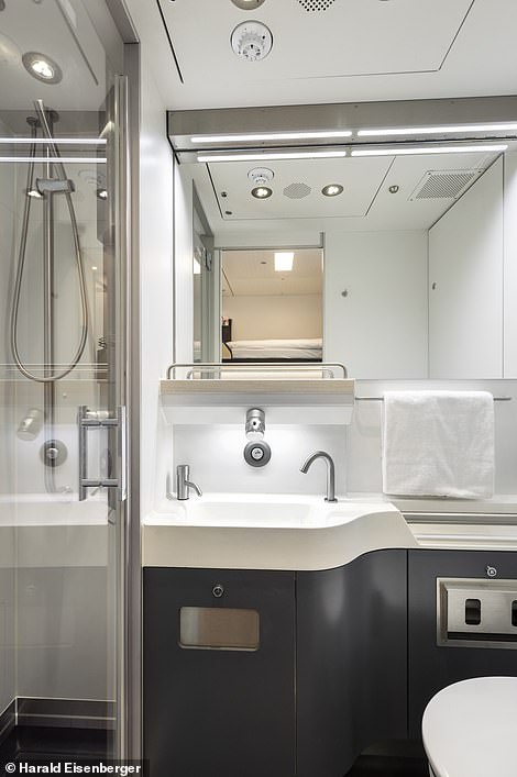 The redesigned sleeper cars feature private bathrooms with showers