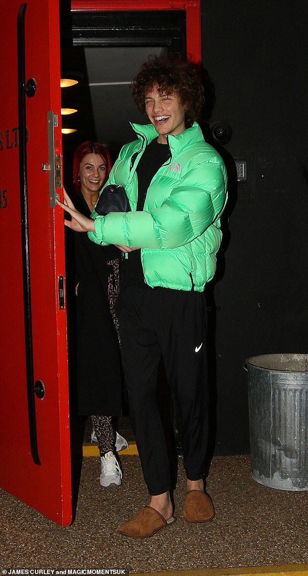 Looking comfortable as they left the training room, Bobby donned a bright green quilted North Face jacket while giving his feet a break from his dancing shoes in a pair of UGG slippers.