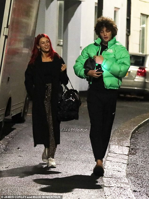 Dianne wore a pair of leopard print gym leggings and a black jacket as she headed back to her hotel for the evening