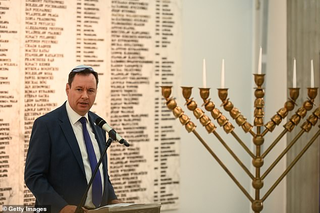 Israeli Ambassador to Poland Yacov Livne delivers a speech during Hanukkah celebrations in parliament on December 12, before the chaos unfolded