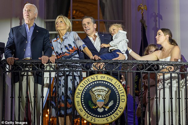 President Joe Biden, first lady Jill Biden, Hunter Biden holding Beau Biden and Naomi Biden watch fireworks on the South Lawn of the White House on the 4th of July