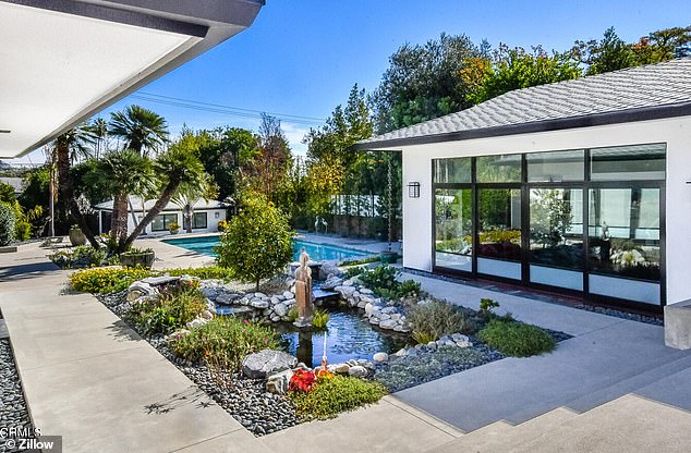 Located in Altadena, California, the five-bedroom, five-bathroom, 4,300-square-foot home features a number of luxurious amenities, including a koi pond garden