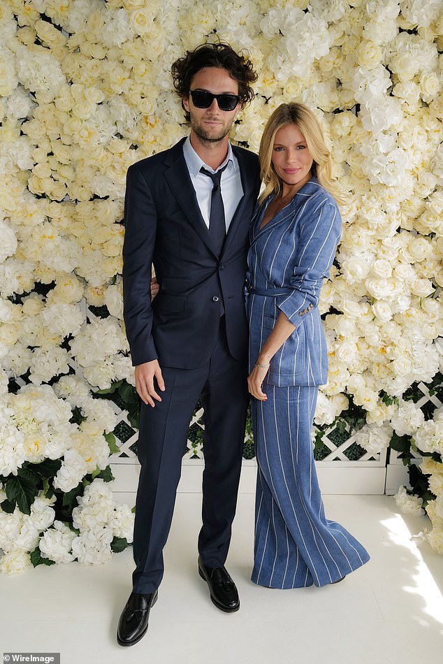 Lovers: Sienna confirmed she is expecting her second child with partner Oli Green, 26, during a beach holiday in August (pictured at Wimbledon in July)