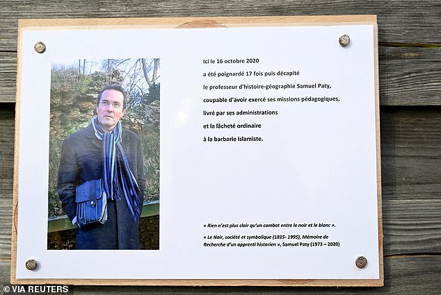 A photo taken on October 16, 2023 shows a memorial plaque for murdered teacher Samuel Paty near the Bois d'Aulne school in Conflans-Sainte-Honorine, outside Paris