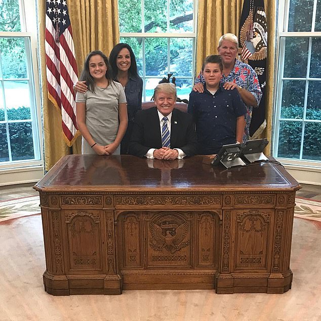 Daly is pictured in the Oval Office with his family and 'great friend' Trump in 2017