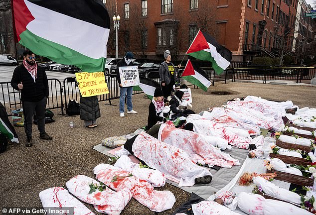 It comes amid ongoing unrest in the US after Hamas terrorists attacked Israel, dividing Americans over support for Israel and the Palestinians in Gaza.  Pictured: Pro-Palestinian protesters lay on the ground outside the White House under sheets covered in fake blood