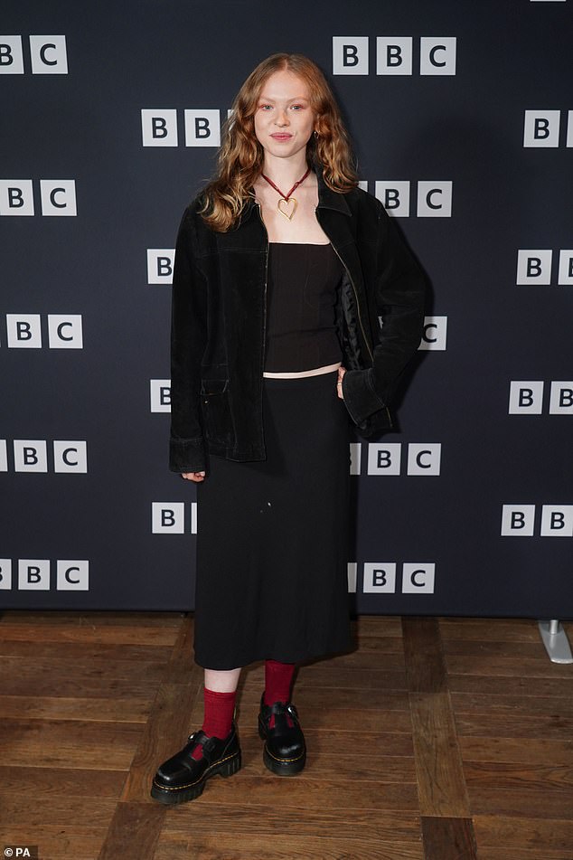 Laura created an all-black look with a top and midi skirt, paired with a matching jacket