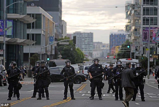 Police line up as they monitor protesters outside the APEC summit on Wednesday