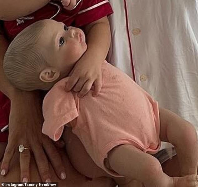 Several users expressed their shock after mistaking the doll for a real baby, with one commenting: 'I was shocked, I thought it was a real baby being held like that'