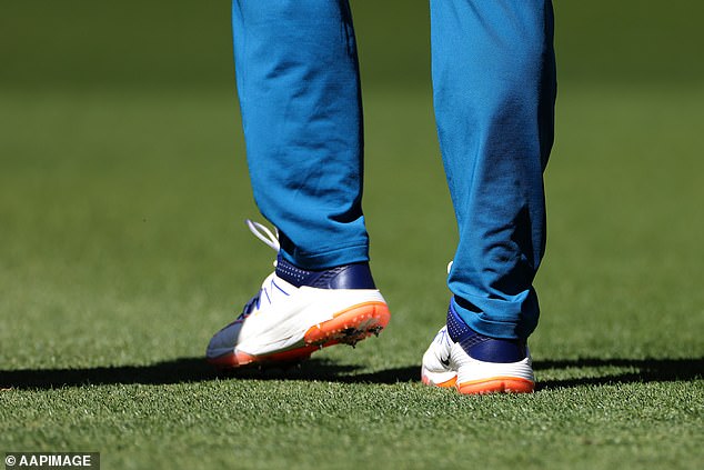 Pictured: Khawaja's taped boots shortly before the start of play on Thursday