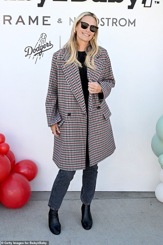 Molly was classically stylish in a burgundy and black houndstooth coat