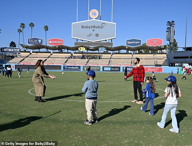 At one point, the Cravings founder was seen with Legend and some kids on the field