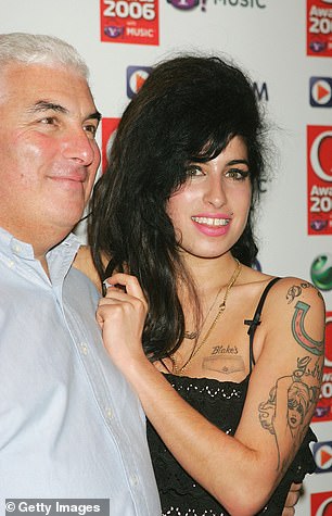 The biopic delves into her early rise and the release of her groundbreaking studio album, Back To Black;  the real Amy Winehouse is seen with her father Mitch in October 2006