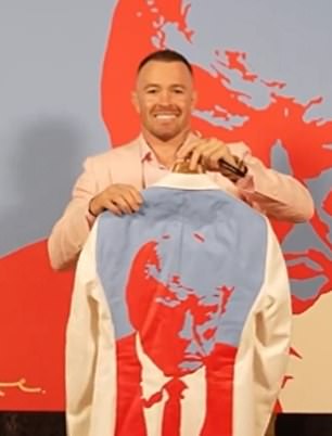 Covington wore a suit with Trump's mugshot printed on the back at the UFC 296 media day presser