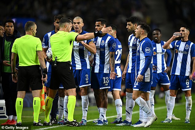 Pepe (No. 3) leads the protests as the referee signals that the goal has been given to Shakhtar